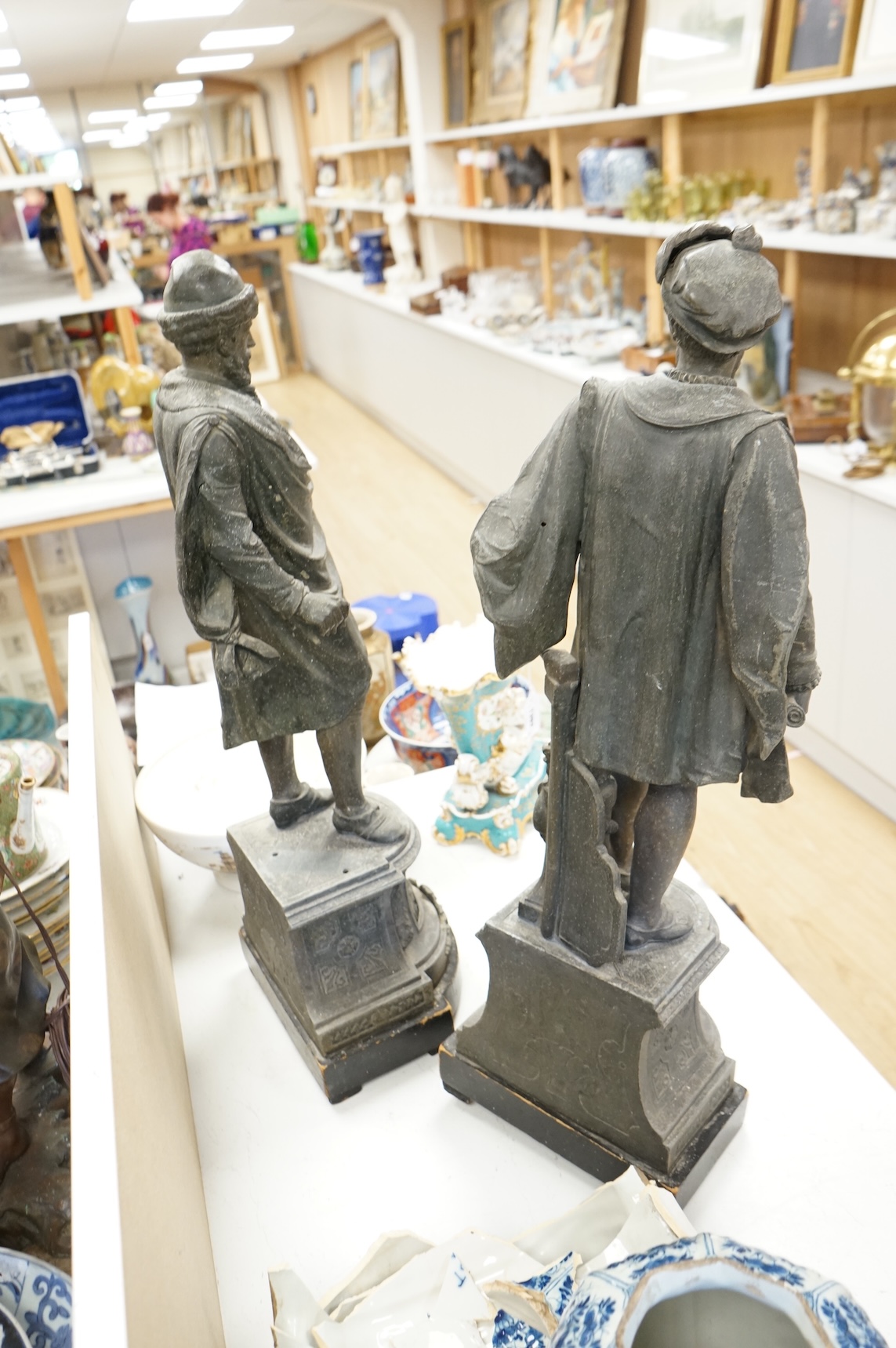 A pair of Victorian spelter figures of Columbus and Gutenberg, 73cm high (damaged)